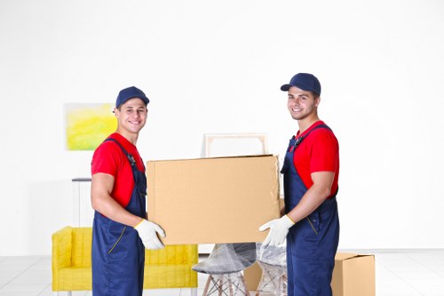 Bulky waste collection truck removing large furniture